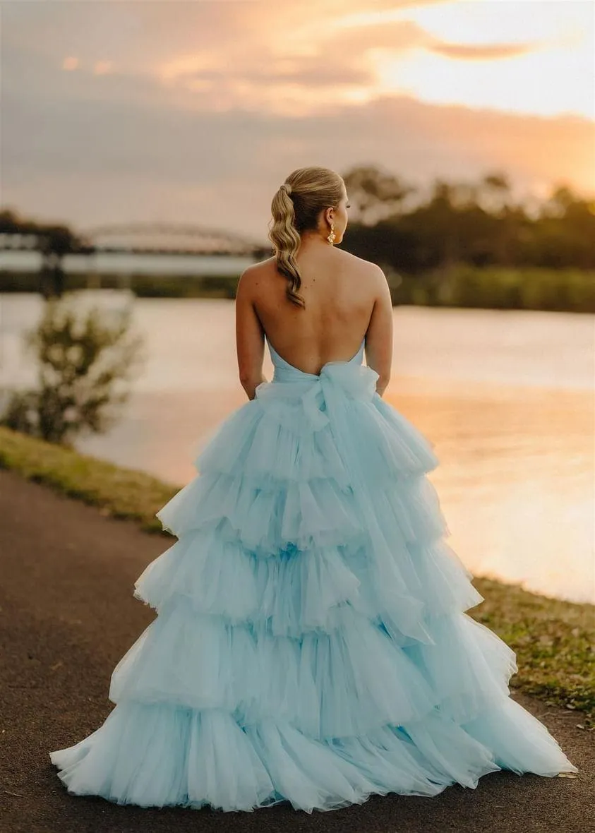 V-neck strapless dress with 5 tiered voluminous tulle skirt with open V back